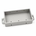 Custom aluminum housing tray showing thin cavity walls, six threaded side holes and slotted mounting ears.