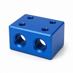 CNC-machined blue anodized guide rod connector block showing clean bore rims, threads and uniform chamfers.