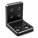 CNC-machined black anodized aluminum bracket showing clean threads, stepped counterbores and uniform chamfers.