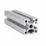 Clean cut end of a silver T-slot aluminum profile showing continuous slots for machine-frame assembly.
